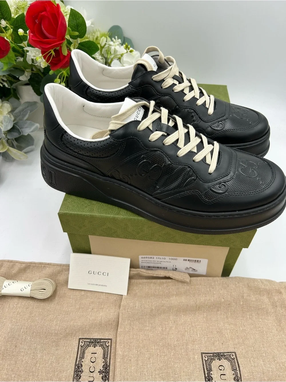 Men's Gucci, GG embossed, black leather sneakers size 11 fits 11.5 made in Italy